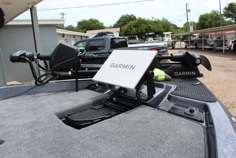 Slide: The Image of 2026 Phoenix 21 XE boat with Garmin navigation system on deck. - 21