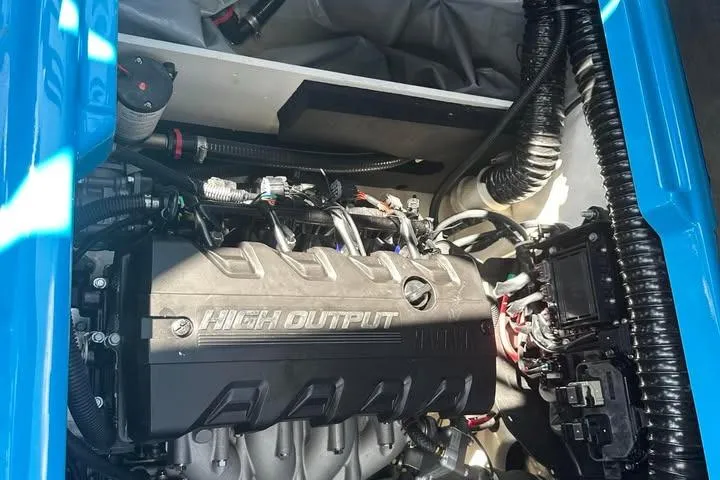 Slide: The Image of 2023 Yamaha Boats 222XD engine compartment showcasing high output engine components. - 10