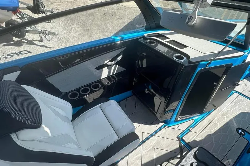 Slide: The Image of 2023 Yamaha Boats 222XD interior with sleek seating and modern dashboard design. - 11