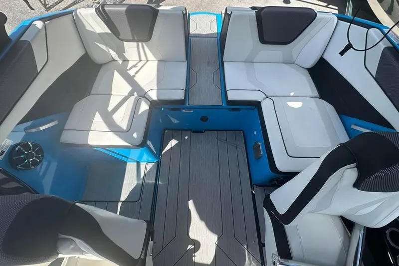 Slide: The Image of 2023 Yamaha Boats 222XD interior with white seating and modern design. - 13