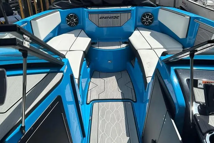 Slide: The Image of 2023 Yamaha Boats 222XD interior with blue and white seating, modern design. - 14