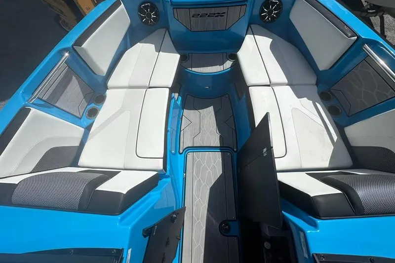 Slide: The Image of 2023 Yamaha Boats 222XD interior with blue and white seating, modern design. - 15