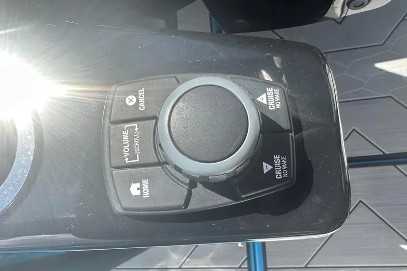 Slide: The Image of Control panel of 2023 Yamaha Boats 222XD with cruise and volume buttons. - 5
