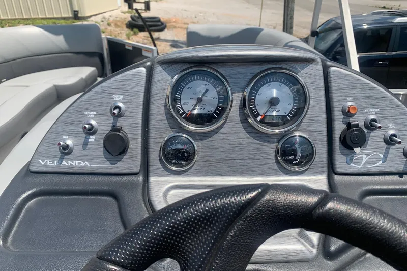 Slide: The Image of Dashboard of 2018 Veranda Relax VR 25 RC boat with gauges and controls. - 11