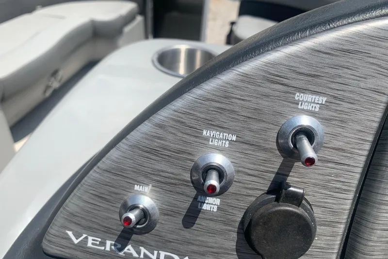Slide: The Image of Control panel of 2018 Veranda Relax VR 25 RC boat with light switches. - 13