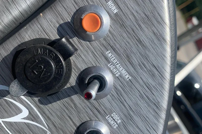 Slide: The Image of Close-up of 2018 Veranda Relax VR 25 RC control panel with switches and 12V outlet. - 14