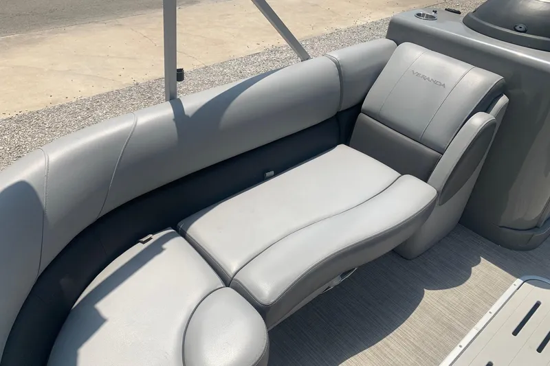 Slide: The Image of 2018 Veranda Relax VR 25 RC boat with gray cushioned seating. - 5
