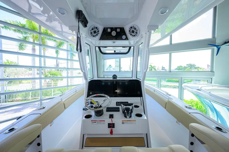 Slide: The Image of 2026 Sportsman Open 252 Center Console boat interior with modern helm and seating. - 14