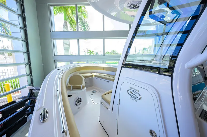 Slide: The Image of 2026 Sportsman Open 252 Center Console boat interior with seating and windows. - 17