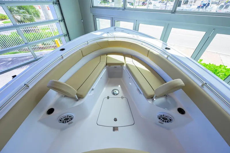 Slide: The Image of 2026 Sportsman Open 252 Center Console boat interior with beige seating and modern design. - 19
