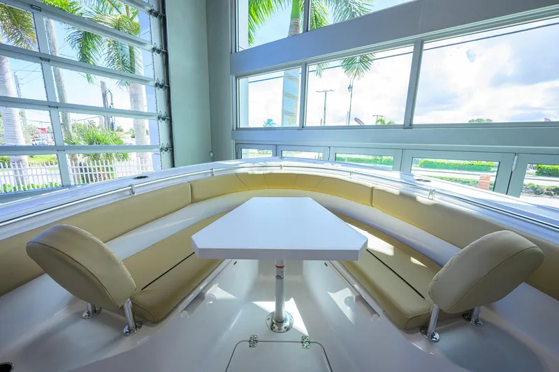 Slide: The Image of Interior of 2026 Sportsman Open 252 Center Console boat with seating and table. - 21