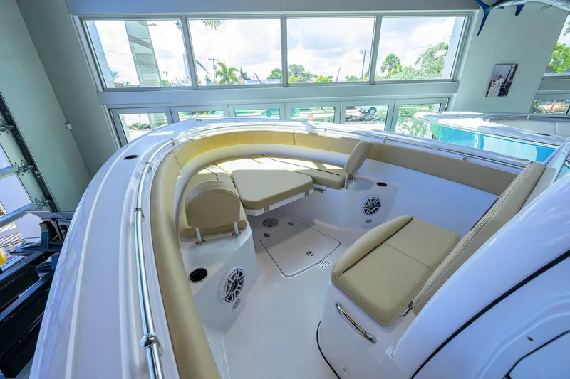 Slide: The Image of 2026 Sportsman Open 252 Center Console boat interior with beige seating and modern design. - 22