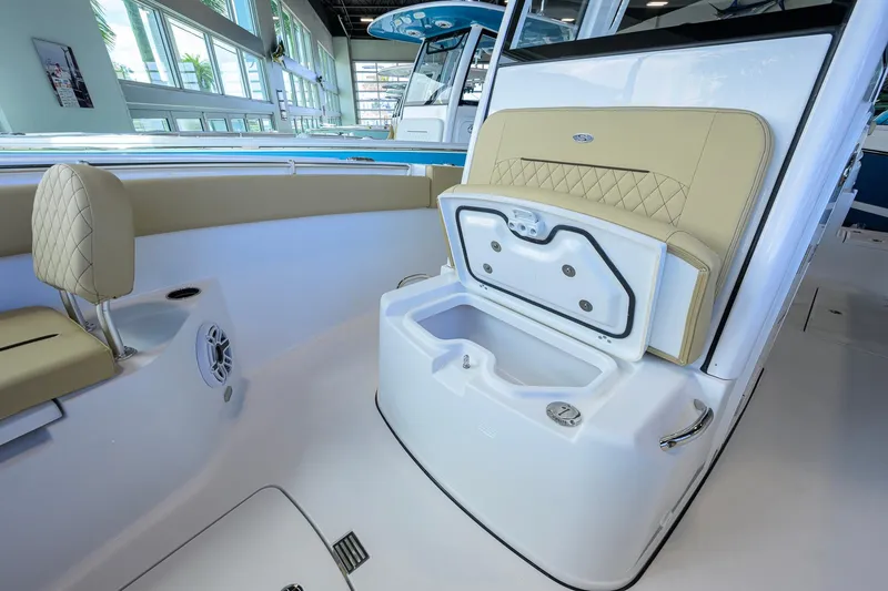Slide: The Image of 2026 Sportsman Open 252 Center Console boat interior with seating and storage compartment. - 27