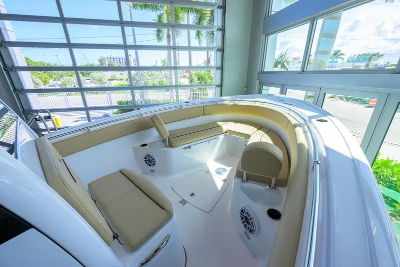 Slide: The Image of 2026 Sportsman Open 252 Center Console boat interior with beige seating and modern design. - 30
