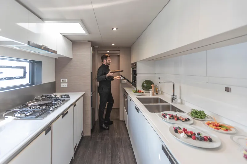 Slide: The Image of 2024 Fountaine Pajot Samana 59 interior cabin with bunk beds and modern design. - 10