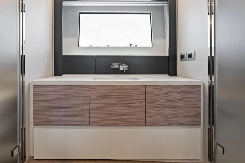 Slide: The Image of Modern bathroom vanity in 2024 Pershing 6X yacht, featuring sleek design and minimalist aesthetics. - 38
