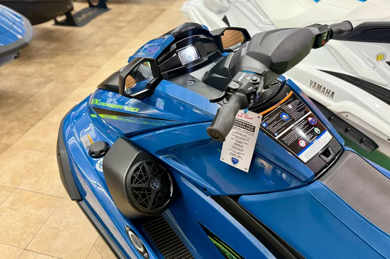 Slide: The Image of 2025 Yamaha WaveRunner VX Cruiser HO with Audio, blue, detailed view of handlebars and controls. - 4