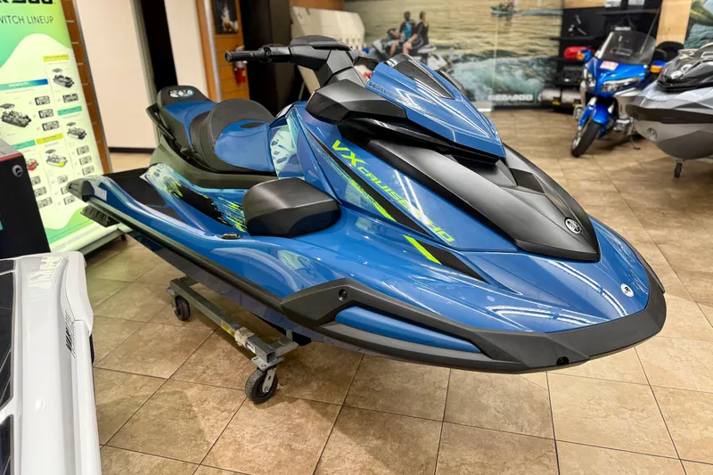 Slide: The Image of 2025 Yamaha WaveRunner VX Cruiser HO with Audio, blue, displayed indoors on a showroom floor. - 8