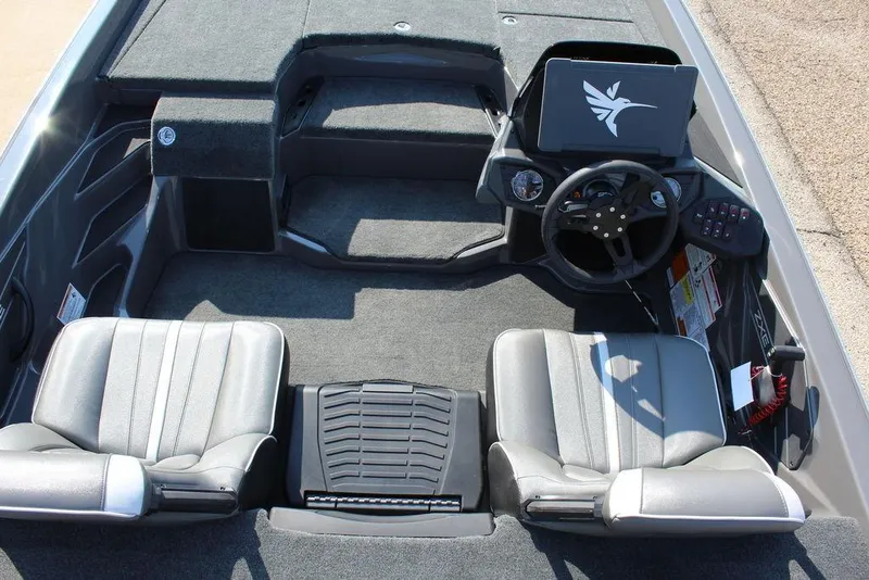 Slide: The Image of Interior of 2026 Skeeter ZXE21 boat with dual seats and steering console. - 11