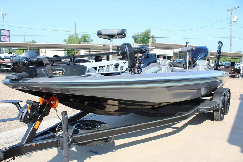 Slide: The Image of 2026 Skeeter ZXE21 fishing boat on trailer, featuring Minn Kota Ultrex motor. - 14