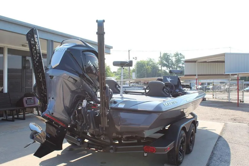 Slide: The Image of 2026 Skeeter ZXE21 boat with Yamaha engine, parked on a trailer in a sunny outdoor setting. - 2