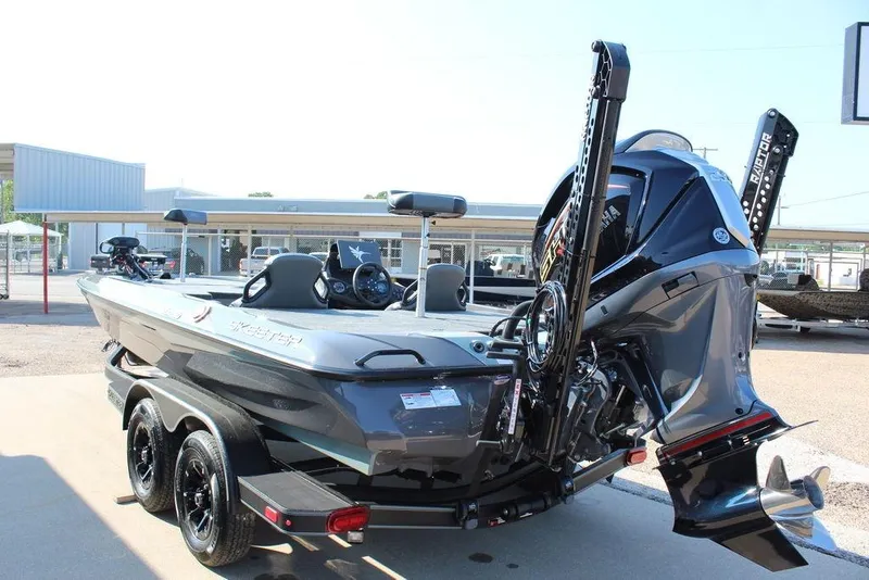 Slide: The Image of 2026 Skeeter ZXE21 boat with dual motors and sleek design on a trailer. - 9