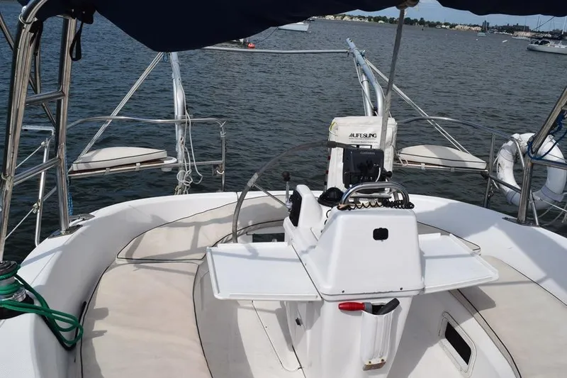 Slide: The Image of Cockpit of 2001 Hunter 340 sailboat with steering wheel and navigation equipment. - 11