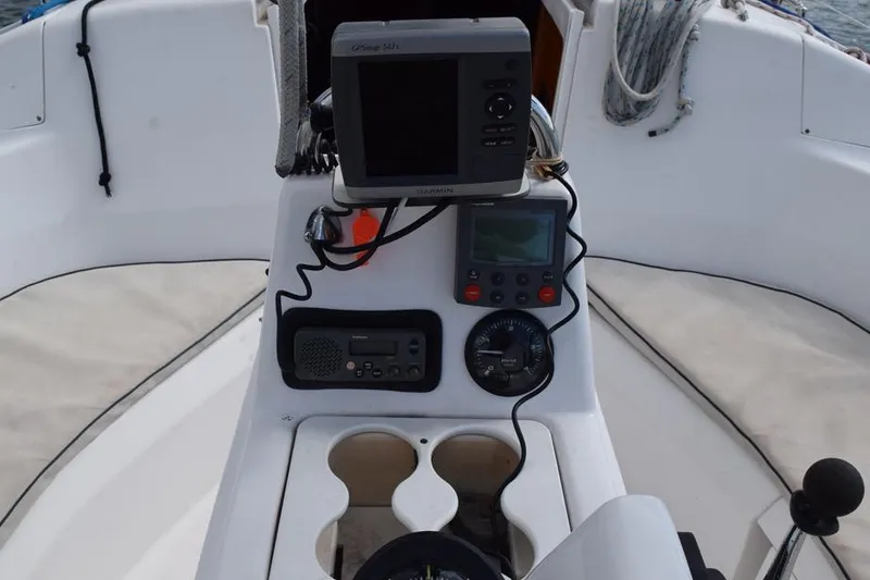 Slide: The Image of Cockpit of 2001 Hunter 340 sailboat with navigation instruments and controls. - 14