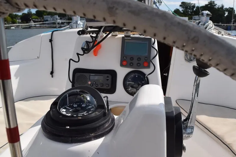 Slide: The Image of Cockpit view of a 2001 Hunter 340 sailboat with navigation instruments and compass. - 15
