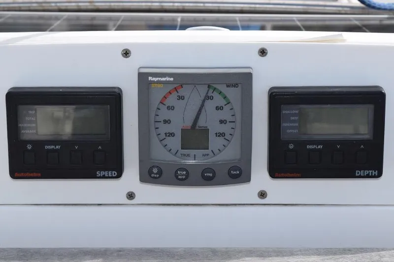Slide: The Image of Instrument panel of a 2001 Hunter 340 sailboat with speed, wind, and depth gauges. - 16