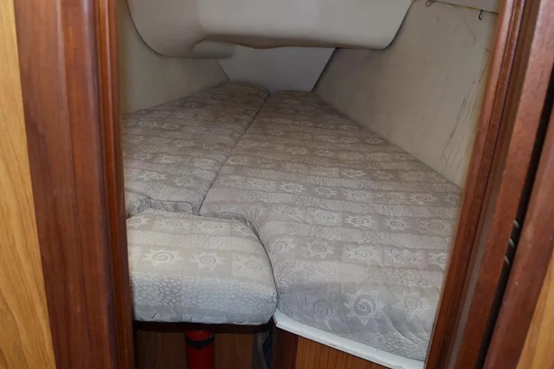 Slide: The Image of Interior cabin of a 2001 Hunter 340 sailboat with a cozy V-berth bed. - 38