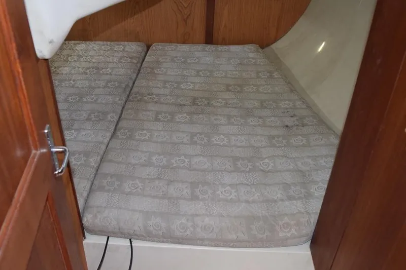 Slide: The Image of Interior cabin of 2001 Hunter 340 sailboat with patterned mattress. - 41