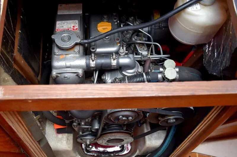 Slide: The Image of Engine compartment of a 2001 Hunter 340 sailboat, showcasing mechanical components. - 46