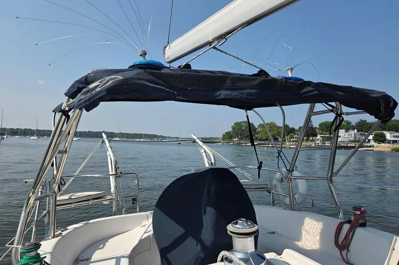 Slide: The Image of Sailboat cockpit view on water, Hunter 340, 2001 model, with blue canopy. - 5