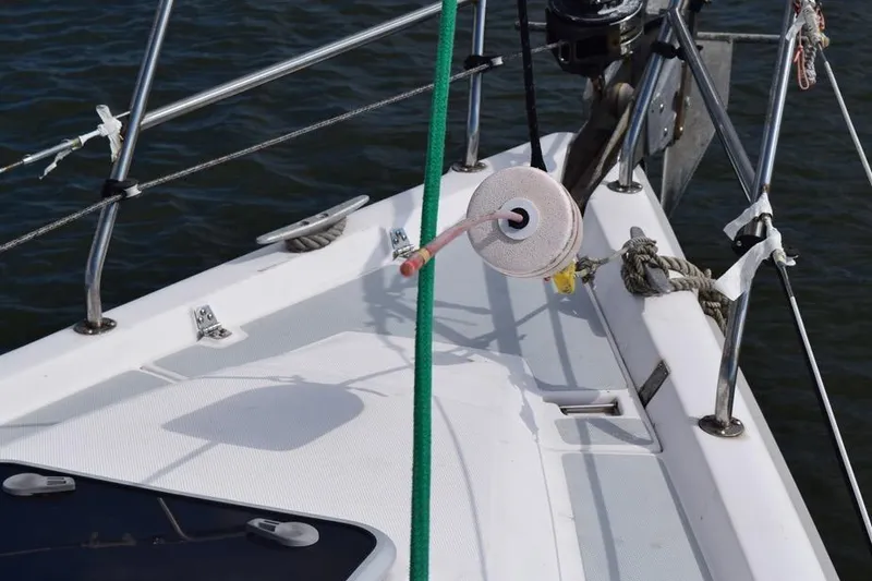 Slide: The Image of Deck of 2001 Hunter 340 sailboat with ropes and fittings in view. - 7