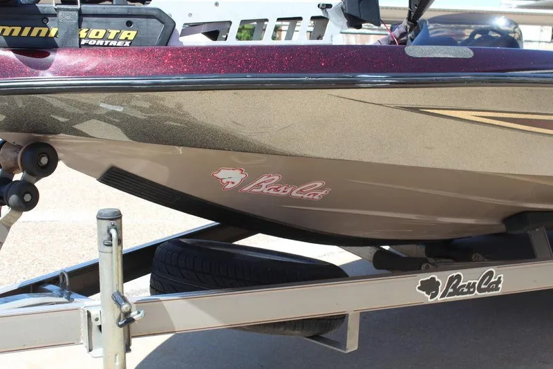 Slide: The Image of 2007 Bass Cat Cougar boat on trailer, featuring Minn Kota Fortrex motor. - 12