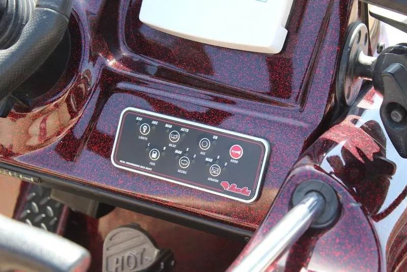 Slide: The Image of 2007 Bass Cat Cougar boat dashboard with control panel and steering wheel. - 14