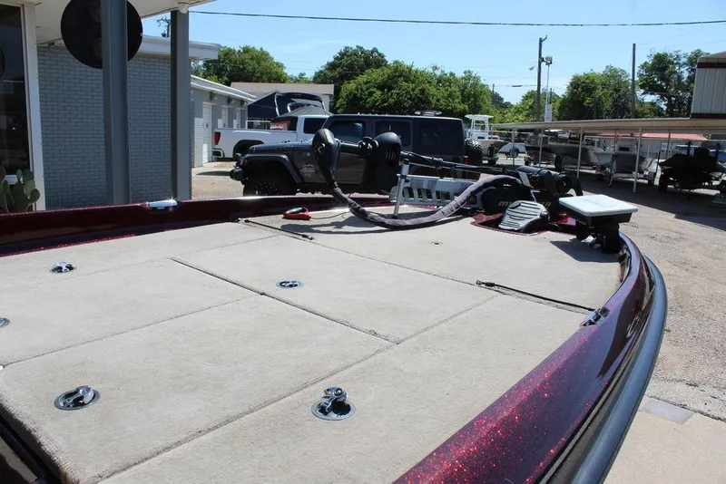 Slide: The Image of 2007 Bass Cat Cougar boat deck with equipment, parked outdoors. - 21