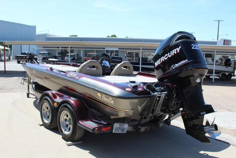 Slide: The Image of 2007 Bass Cat Cougar boat with Mercury 225 OptiMax engine, parked on a trailer. - 6