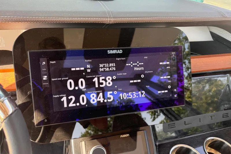 Slide: The Image of Dashboard of 2026 Monterey Elite 27 SD boat with navigation and performance data. - 20