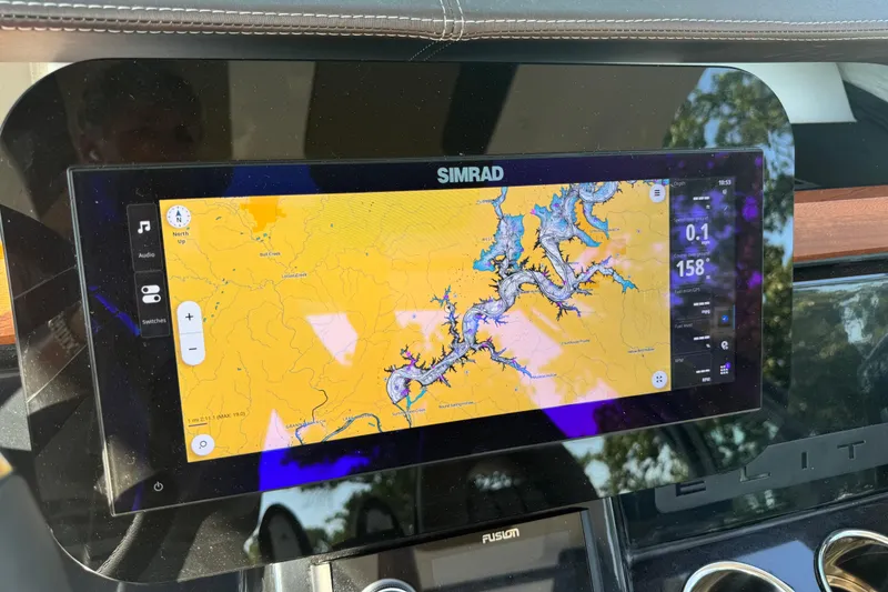 Slide: The Image of Simrad navigation display on 2026 Monterey Elite 27 SD boat dashboard. - 21