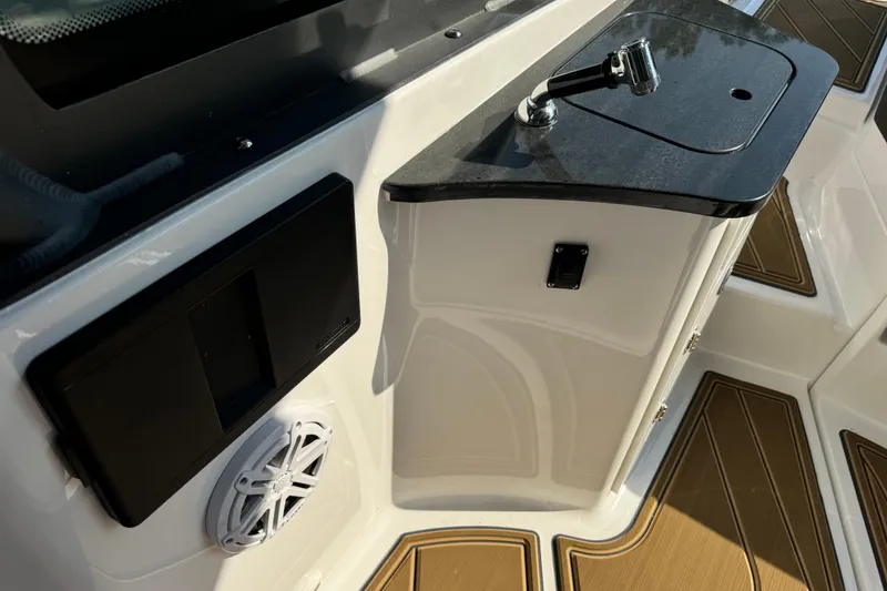 Slide: The Image of Interior of 2026 Monterey Elite 27 SD boat with control panel and speaker. - 22