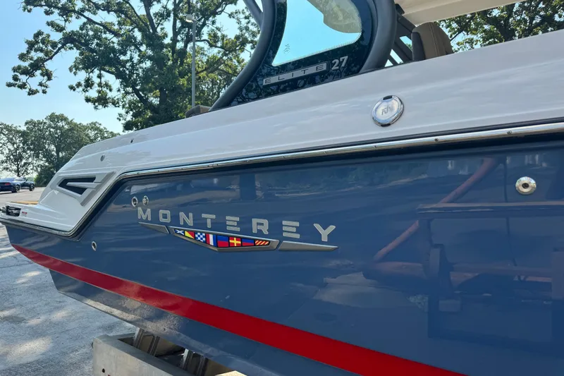 Slide: The Image of 2026 Monterey Elite 27 SD boat with sleek design and vibrant colors. - 7