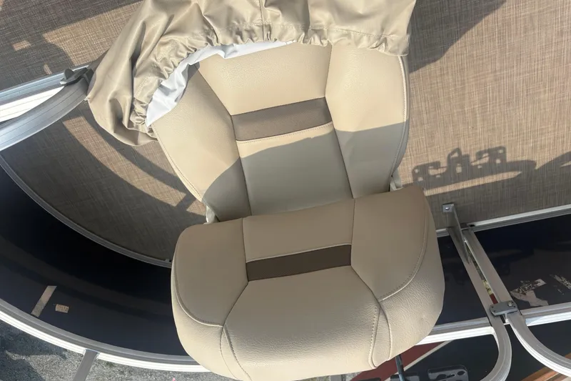 Slide: The Image of Sun Tracker Bass Buggy 16 XL 2022 boat seat with beige upholstery and cover. - 13