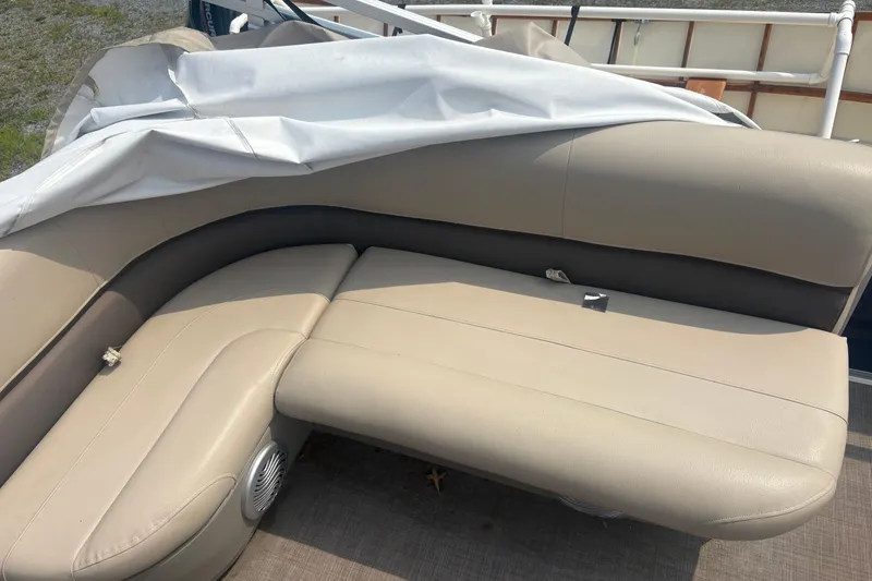 Slide: The Image of 2022 Sun Tracker Bass Buggy 16 XL boat with beige seating and white cover. - 7