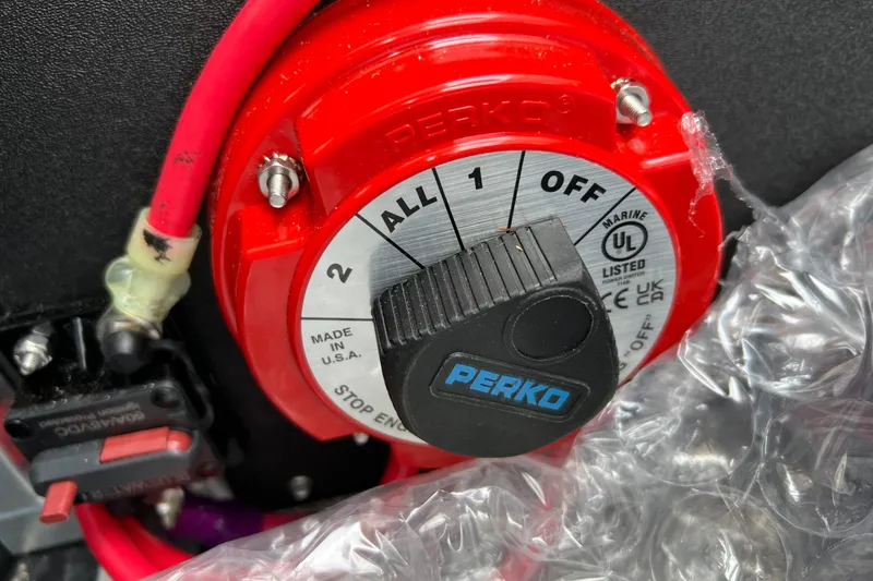 Slide: The Image of Red Perko marine battery switch on Tahoe TRITOON 2185, 2026 model. - 17