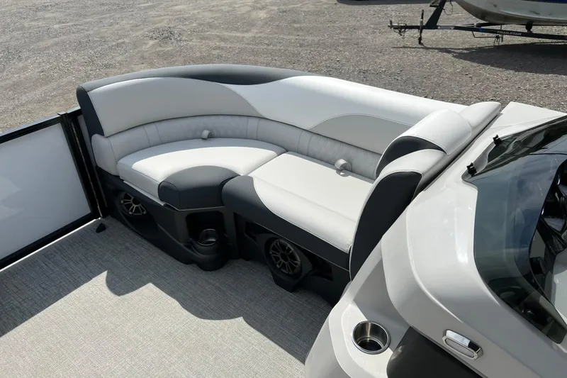 Slide: The Image of 2026 Tahoe TRITOON 2185 boat interior with stylish seating and cup holders. - 21