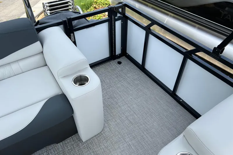 Slide: The Image of Interior of 2026 Tahoe TRITOON 2185 boat with gray seating and cup holder. - 24