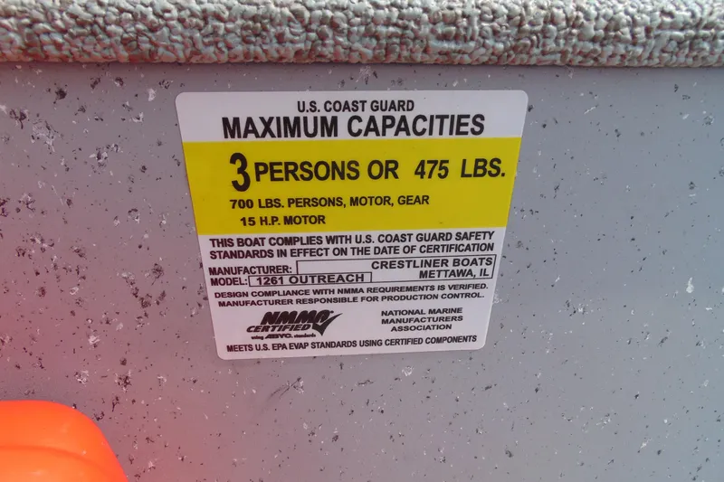 Slide: The Image of 2022 Crestliner 1261 Outreach capacity label: 3 persons or 475 lbs, 15 HP motor. - 9