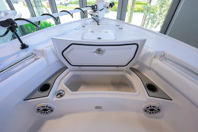 Slide: The Image of 2026 Sportsman Masters 247OE Bay Boat interior with storage compartments and cup holders. - 10